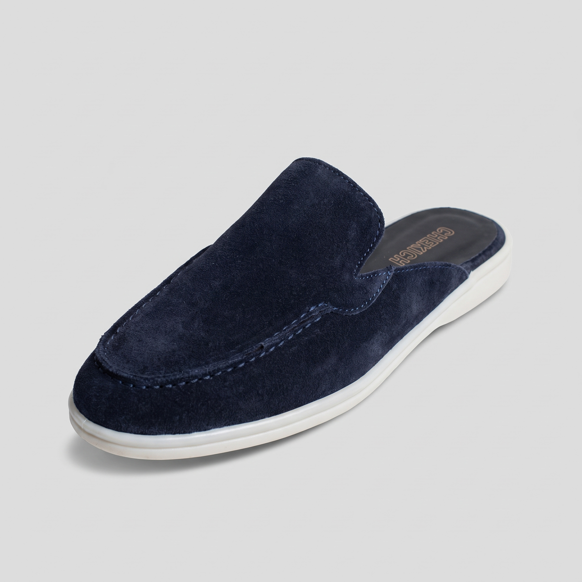 Navy Clifton Mule by Chekich South Africa featuring a stylish slip-on design and pointed toe for casual elegance.