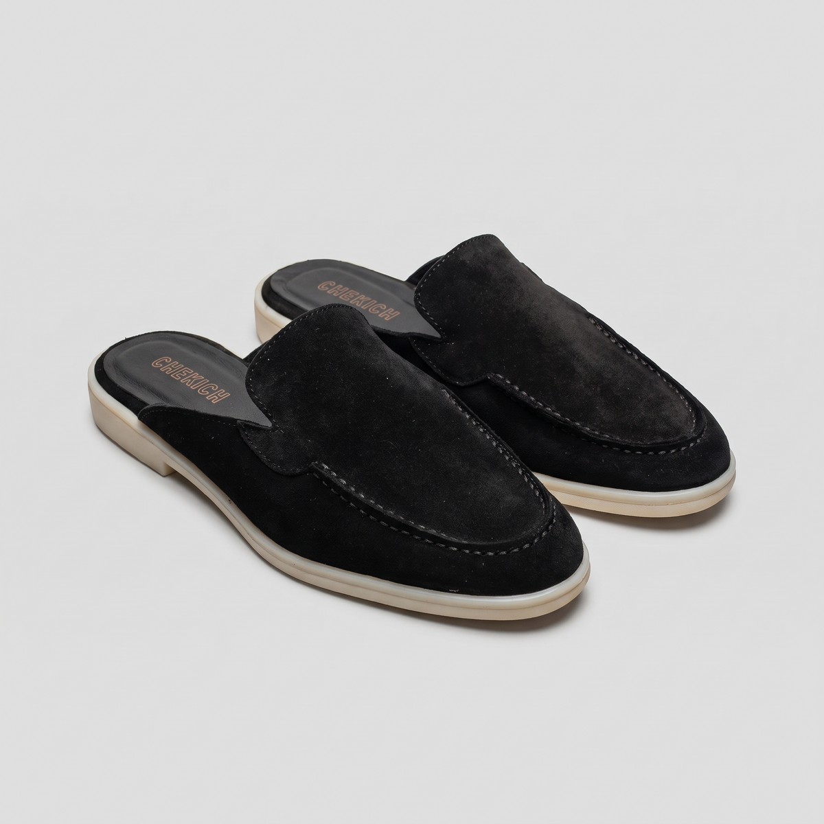 Black Clifton Mule by Chekich South Africa, showcasing a stylish slip-on shoe with sleek design and comfortable fit.