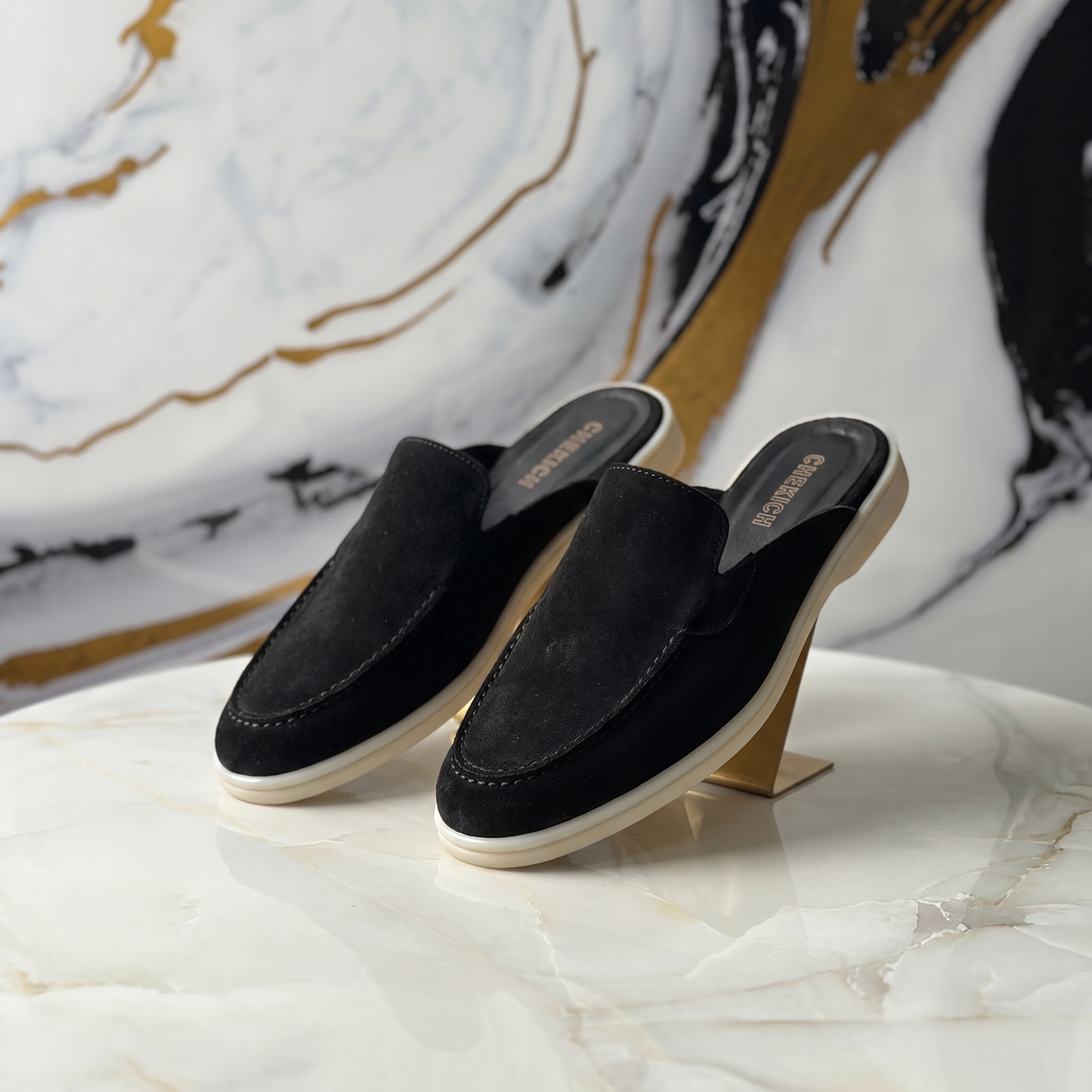 Black Clifton Mule by Chekich South Africa featuring a sleek design and comfortable slip-on style.