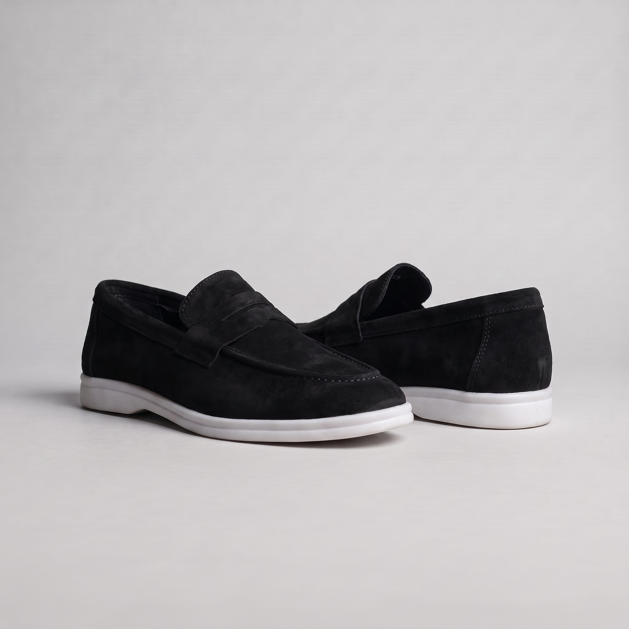 Chekich South Africa Clifton Black footwear display showcasing sleek black shoes with minimalist design.