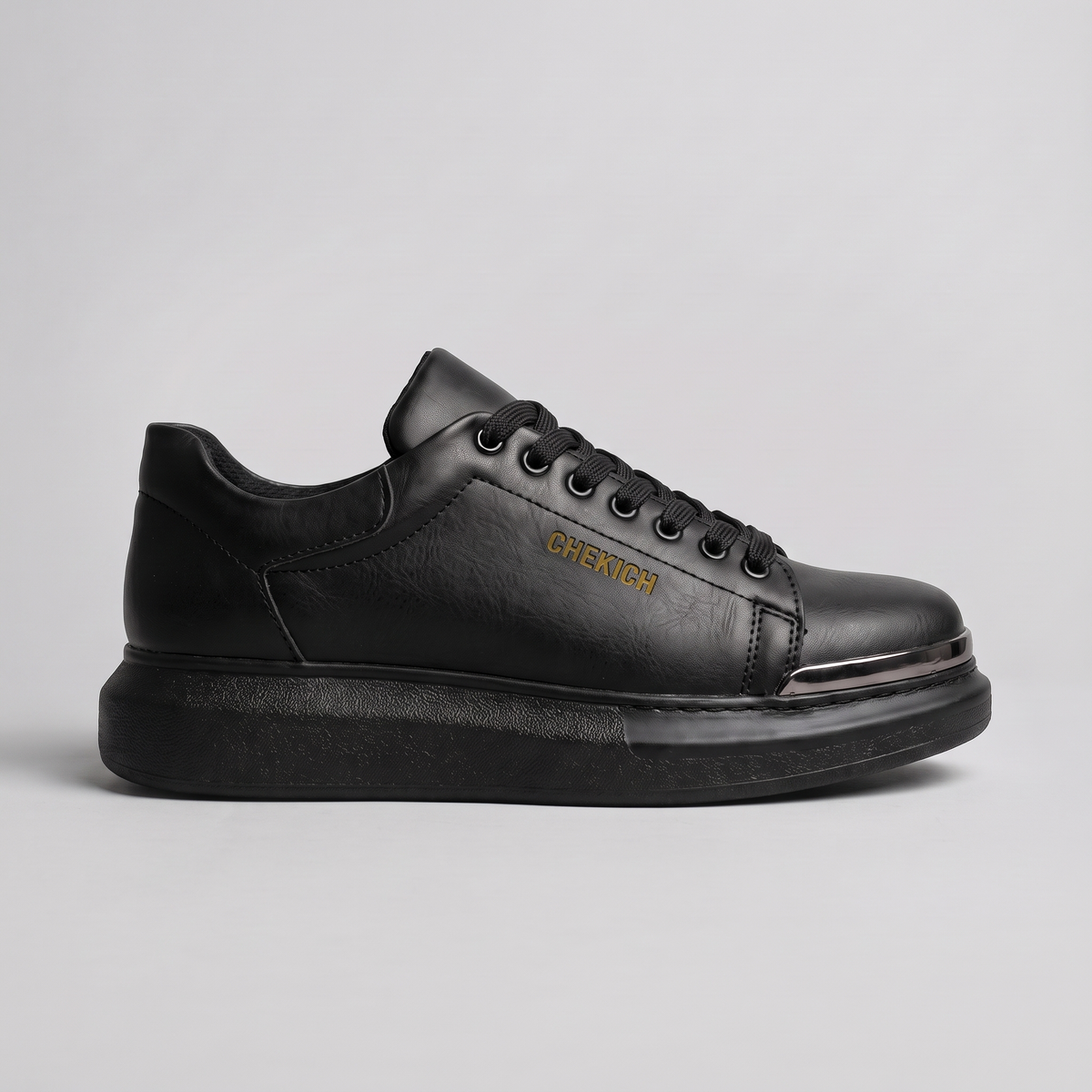 Chekich FANTASIA ST sneakers, side view of the black lace-up upper with rose-gold toe cap on a black platform sole