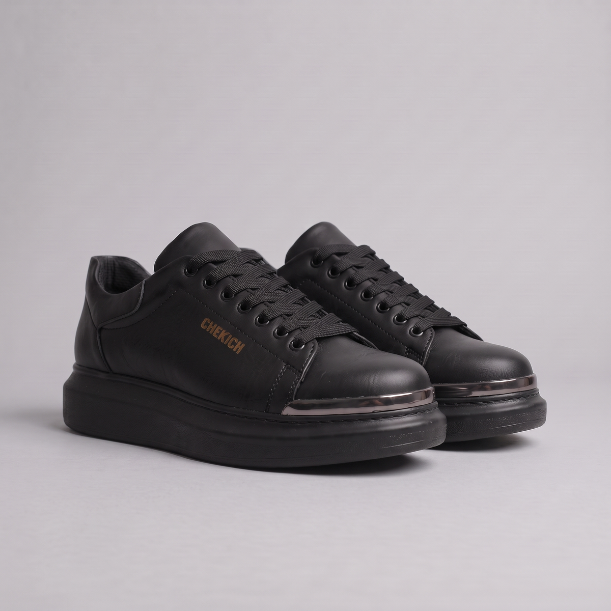 Chekich FANTASIA ST sneakers pair, side angle on a grey background