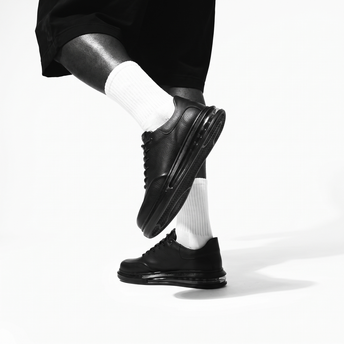 Black AVAX Sneakers by Shopify with sleek design and modern silhouette, featuring a smooth black finish and stylish athletic look.