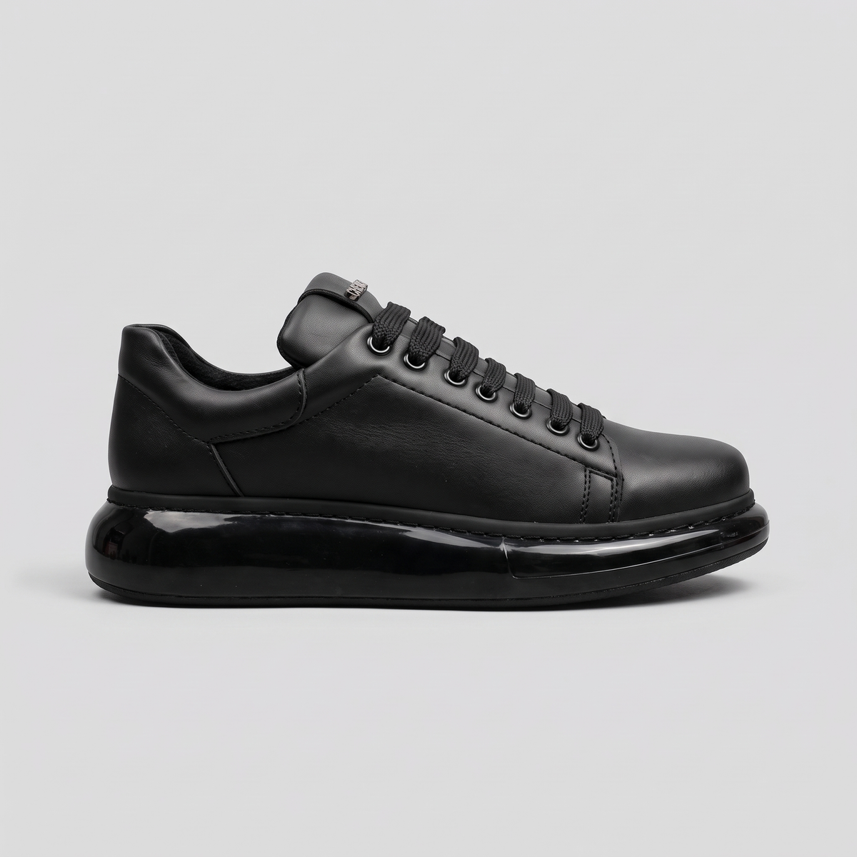Chekich FANTASIA X All Black sneakers, side view of the matte black lace-up upper on a gloss black platform sole