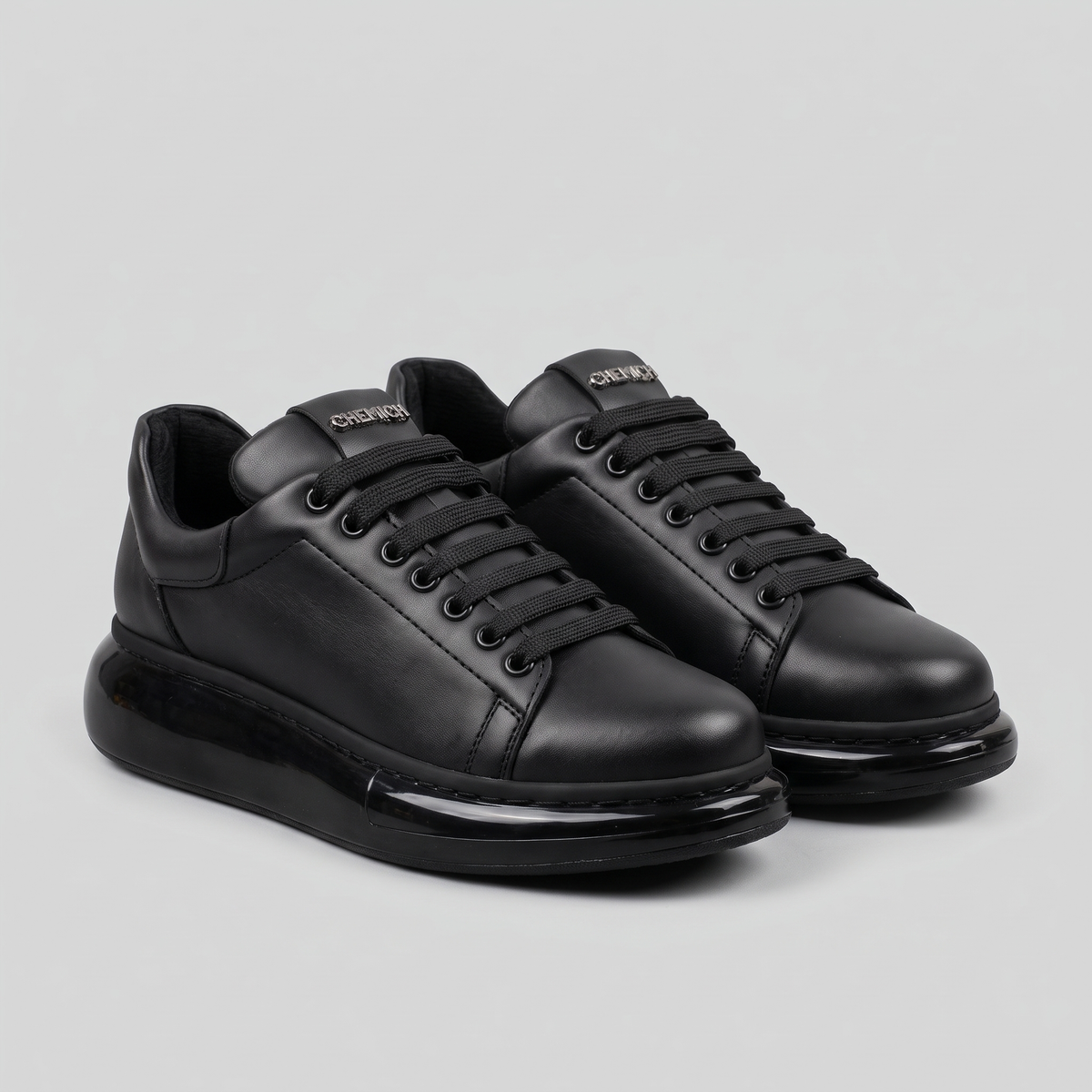 Chekich FANTASIA X All Black sneakers pair, three-quarter view showing the gloss platform sole