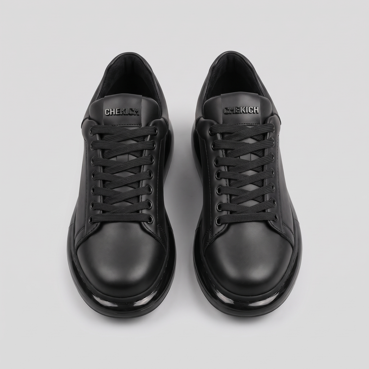 Chekich FANTASIA X All Black sneakers pair, top view showing the laces and CHEKICH tongue tab