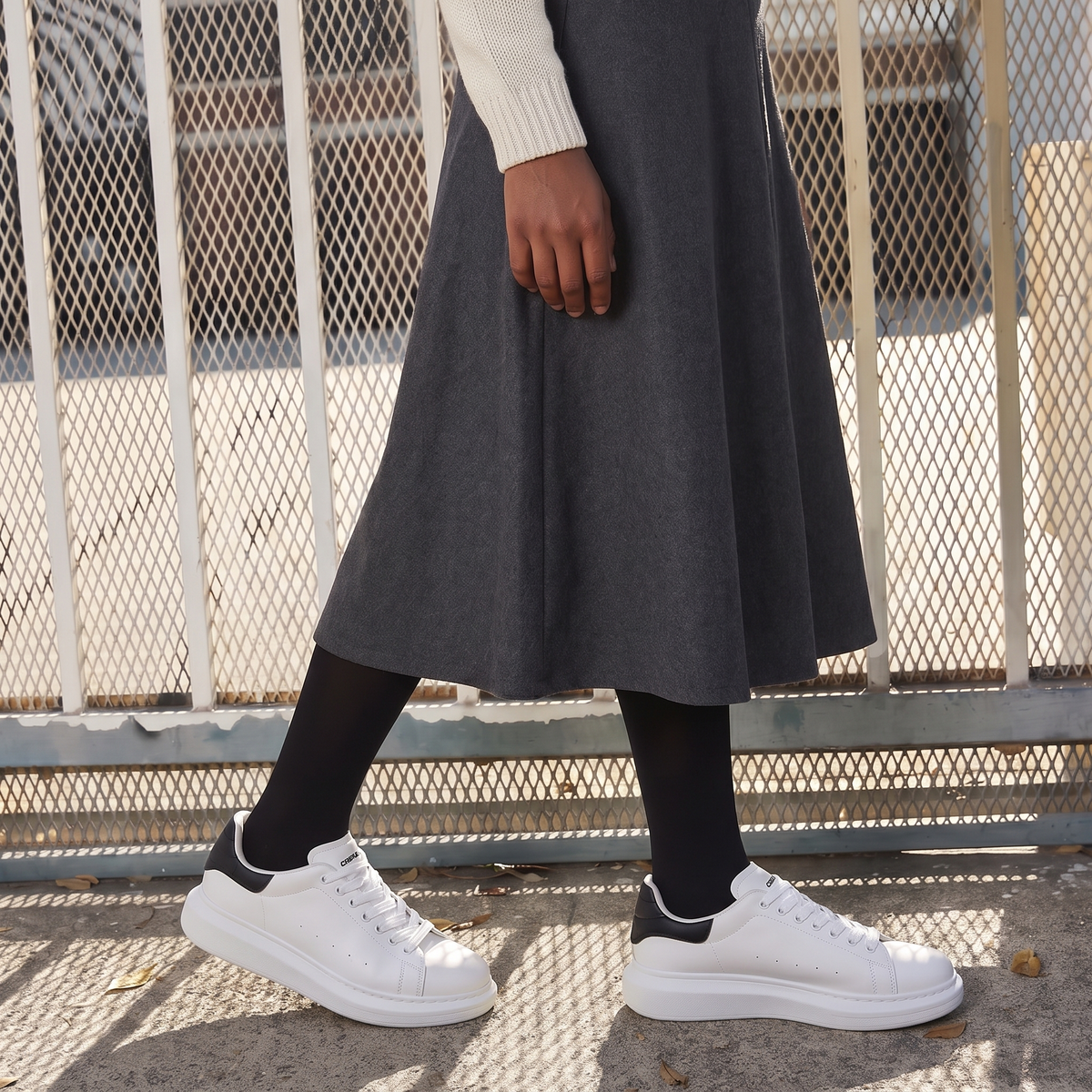 Black ORIGIN sneakers by Shopify featuring a sleek design with black laces and a modern athletic silhouette.