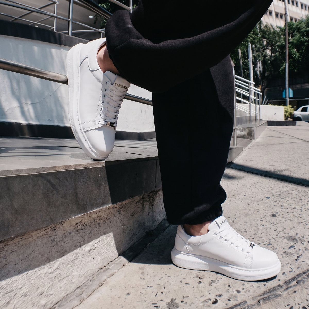 White FANTASIA plain sneakers by Shopify with clean design and white laces, shown from a side angle on a white background.