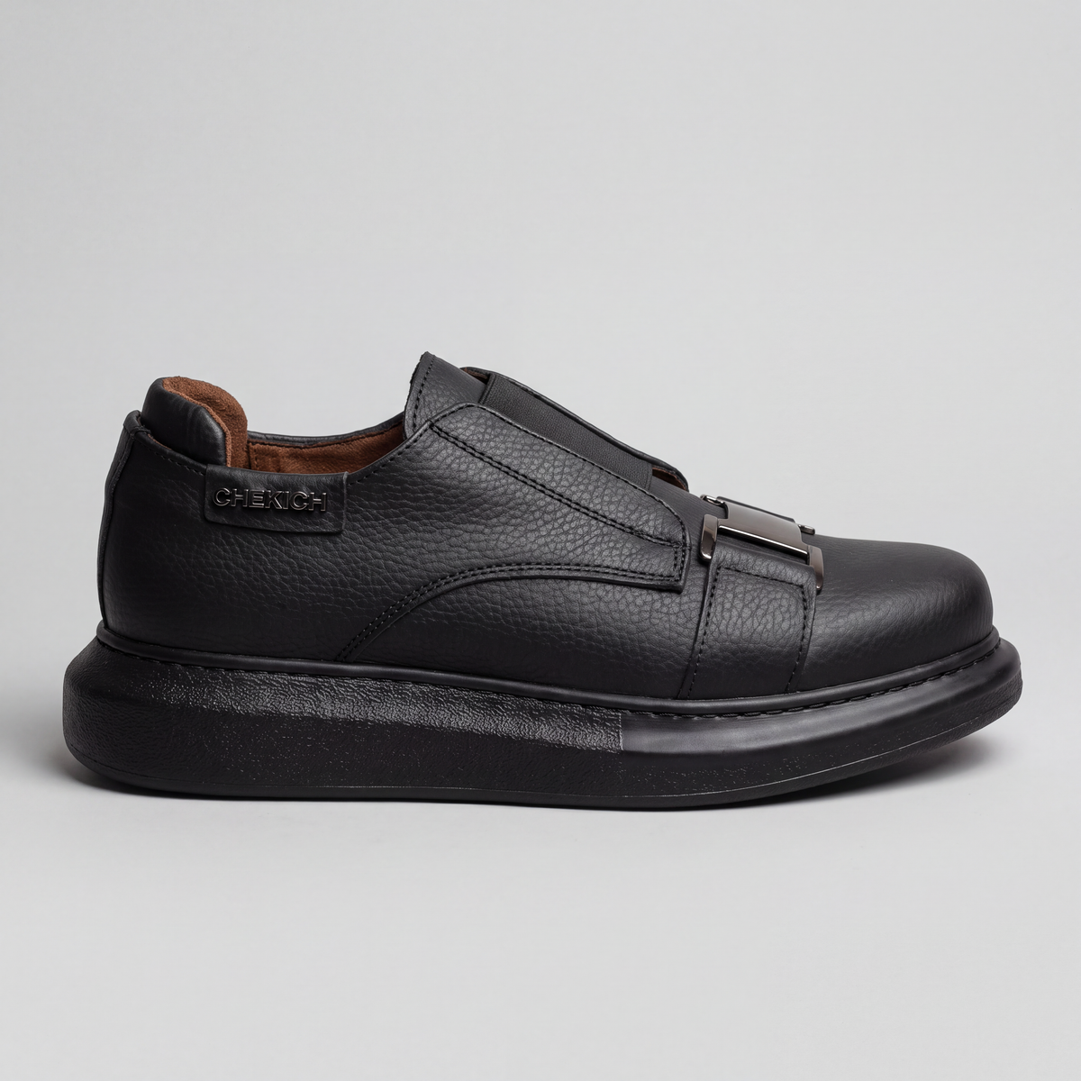 Black Chekich South Africa VIP V2 sneakers with sleek design and laces, showcasing the all-black athletic footwear.