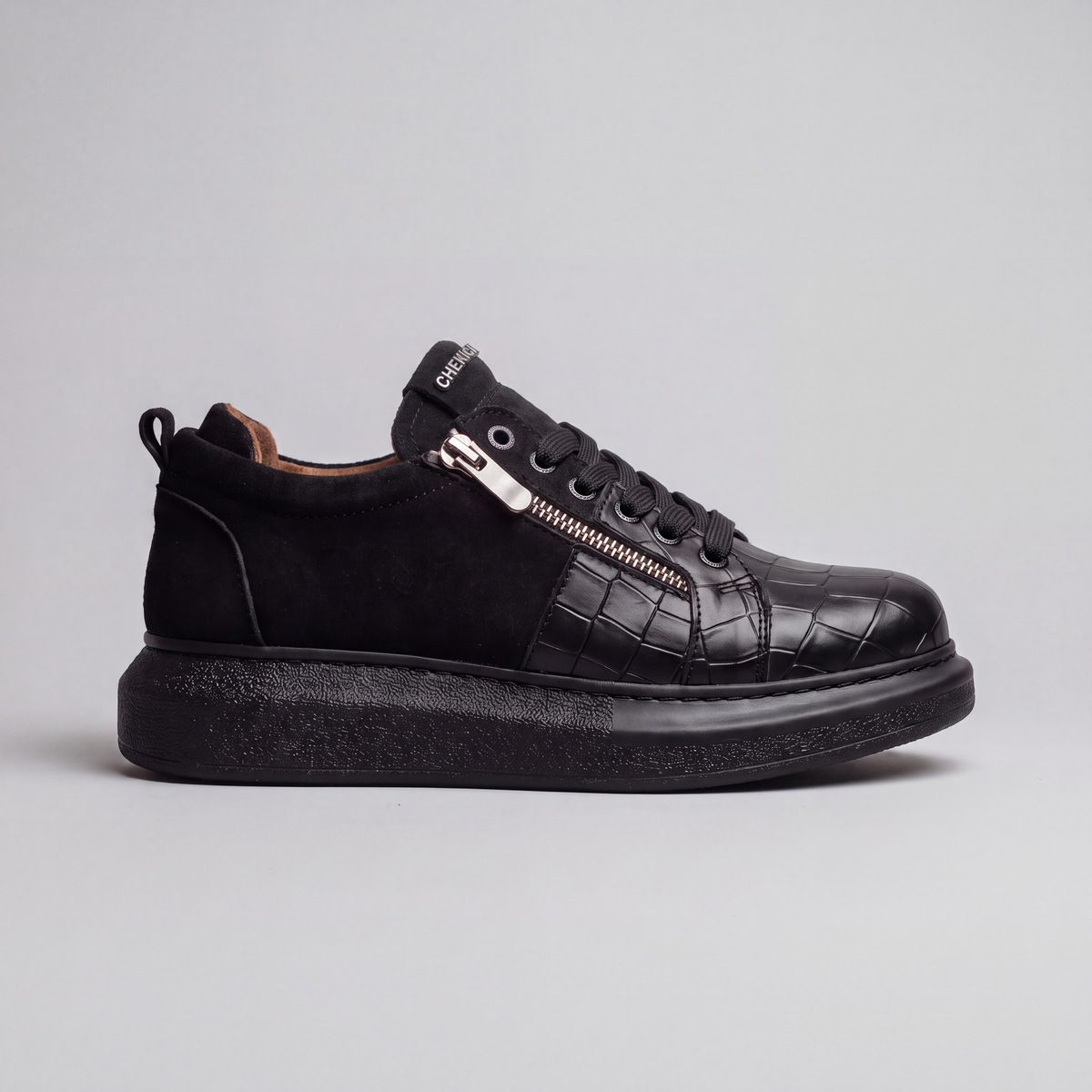All black Chekich South Africa Phantom V2 sneaker with sleek design and modern style, shown from a side angle.