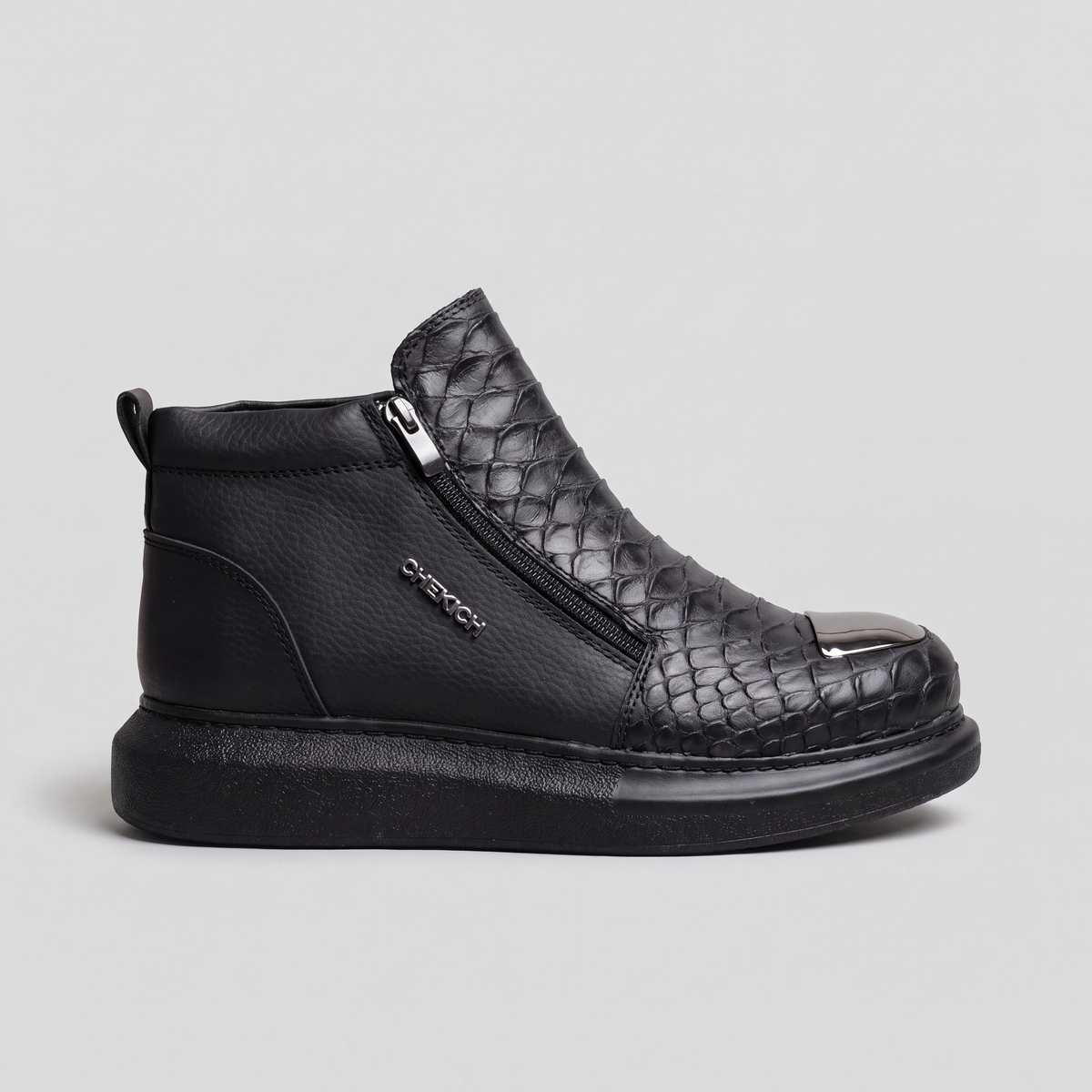 Black MOB sneakers by Chekich South Africa with sleek design and white sole, shown from side angle.