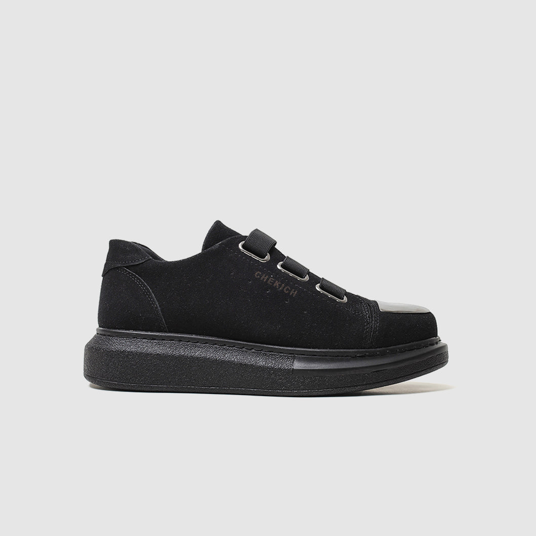 Shopify Mirror Suede All Black sneakers with sleek black suede material and modern design, shown from a side view.