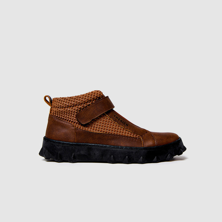 Dark brown Pyramid Long boots by Shopify, featuring a sleek design, tall shaft, and stylish pyramid detailing.