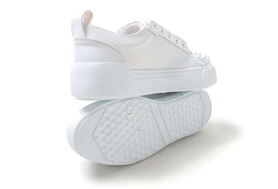 White Thorn sneakers by Shopify featuring a sleek design and white laces, displayed on a neutral background.