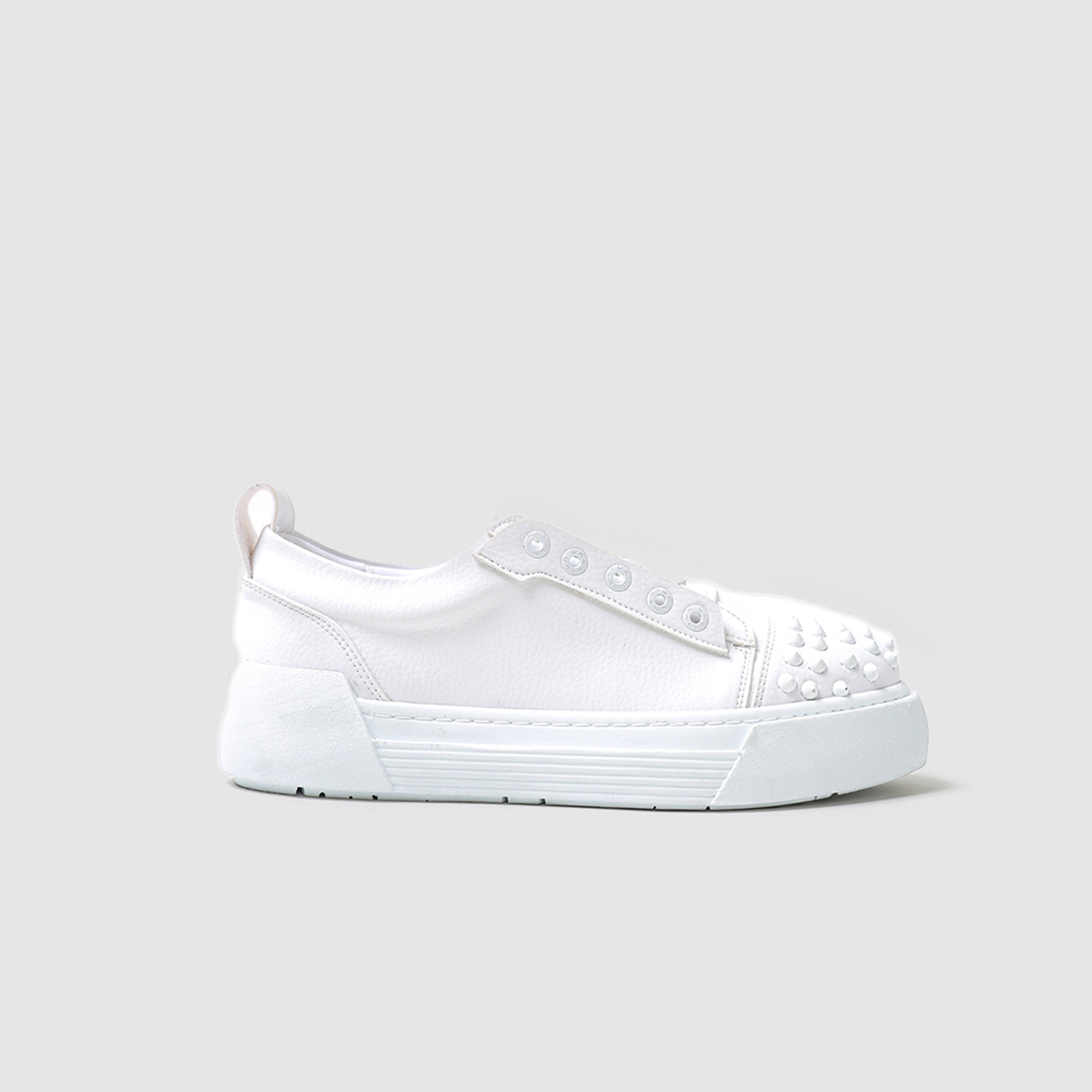 White THORN Sneakers by Shopify featuring a sleek design with white laces and sporty silhouette.